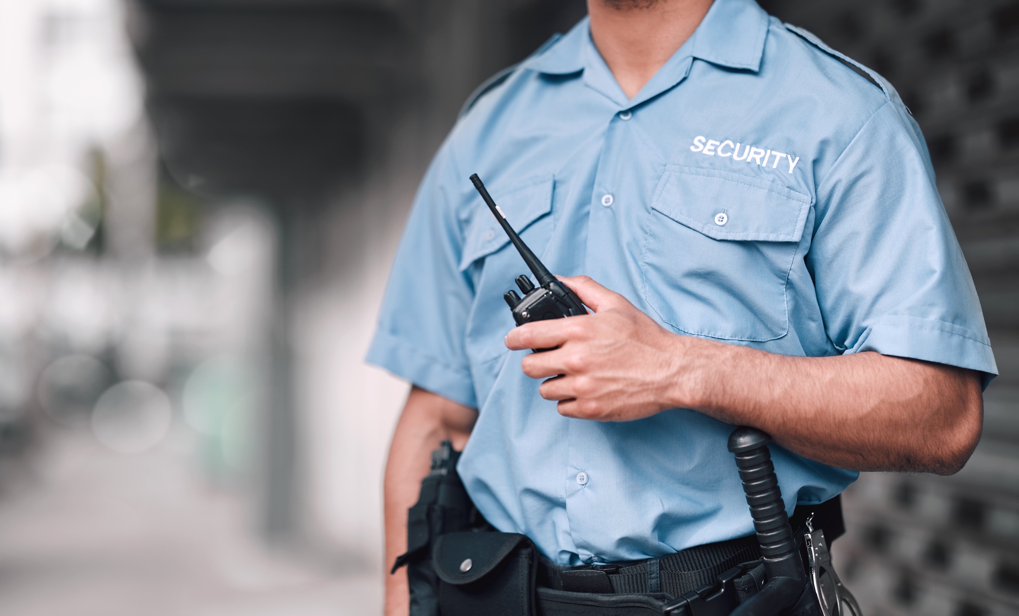Walkie talkie, security guard or safety officer man on the street for protection, patrol or watch.